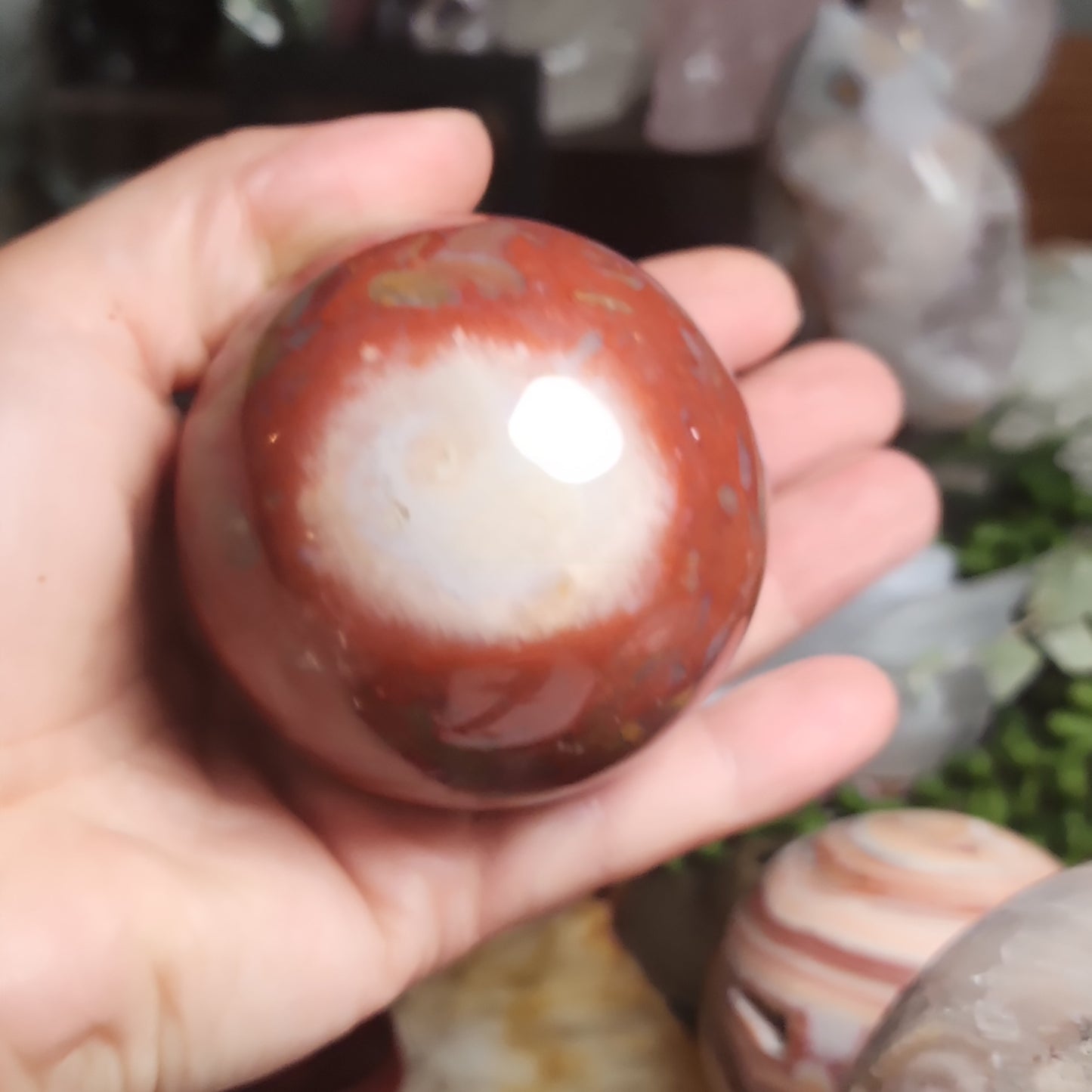 Red jasper sphere with quartz