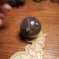 Banded druzy black flower agate sphere