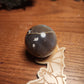 Banded druzy black flower agate sphere