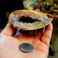 Large open quartz geode with suprise