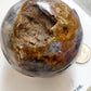 Large druzy ocean jasper sphere