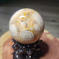 Druzy filled flower agate sphere