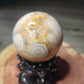 Druzy filled flower agate sphere