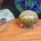 Large ocean jasper palmstone with quartz druzy