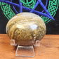 Large ocean jasper palmstone with quartz druzy