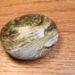 Large ocean jasper palmstone with quartz druzy