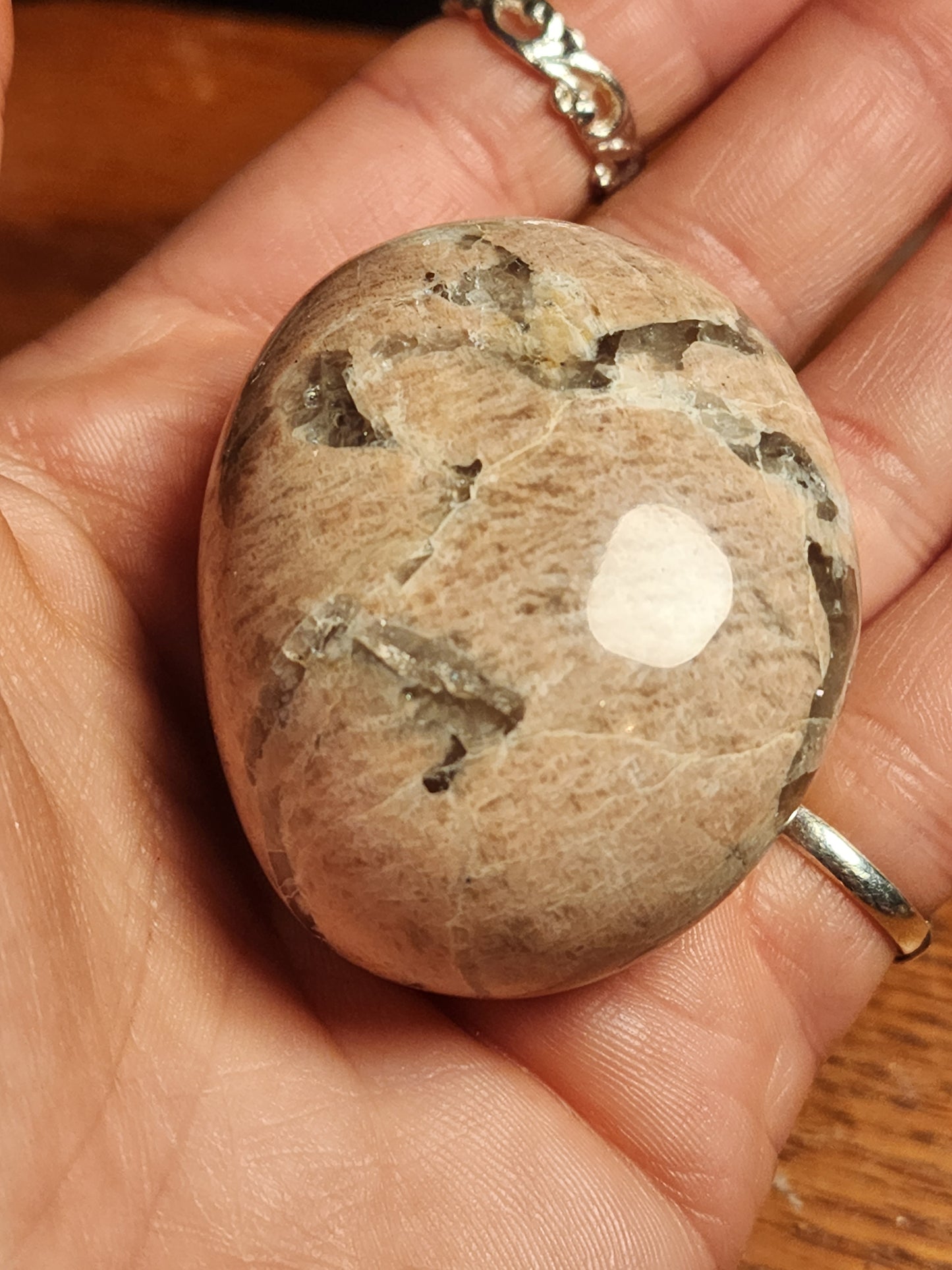 Flashy peach moonstone with smokey quartz palmstone